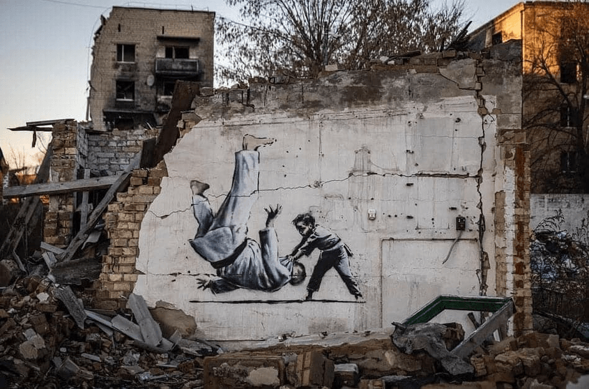 Бородянка, Украйна, Bansky графит, джудо, момче обръща Путин