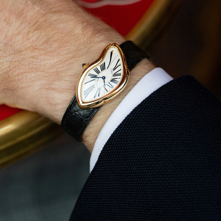 Cartier Crash часовник, история