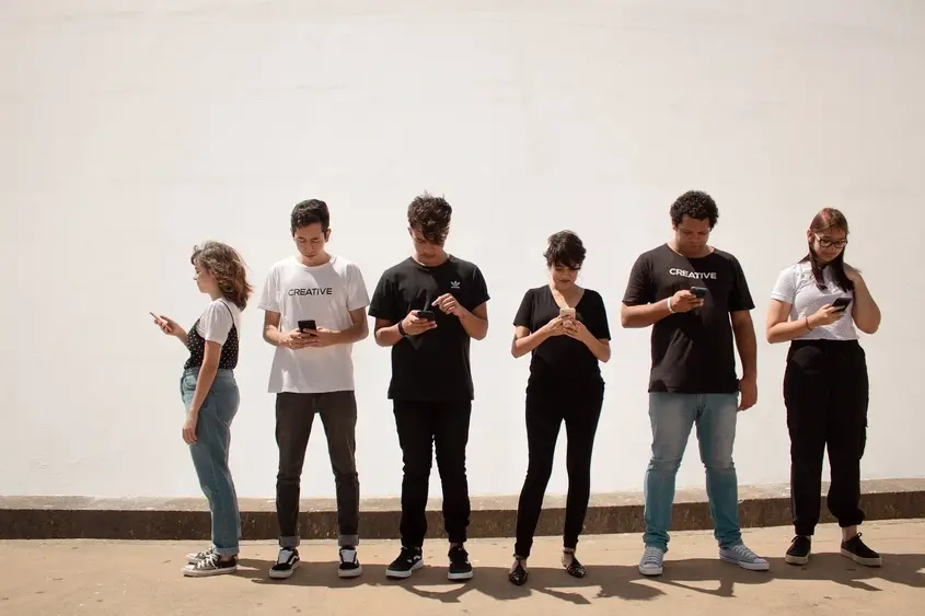 Young adults and teens on Smartphone