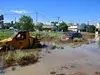 Щетите от наводнението в Гърция